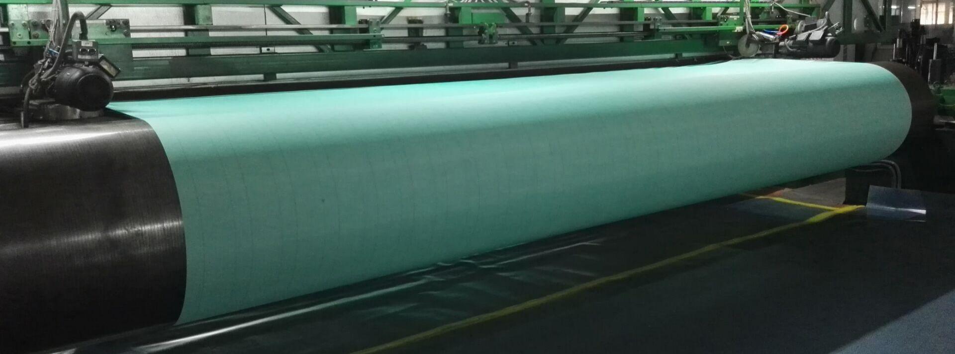 m&aacute;quina de papel que forma la tela tejida